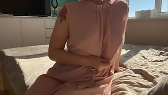 A Girl In A Pretty Pink Dress Indulges In Some Sensual Exploration